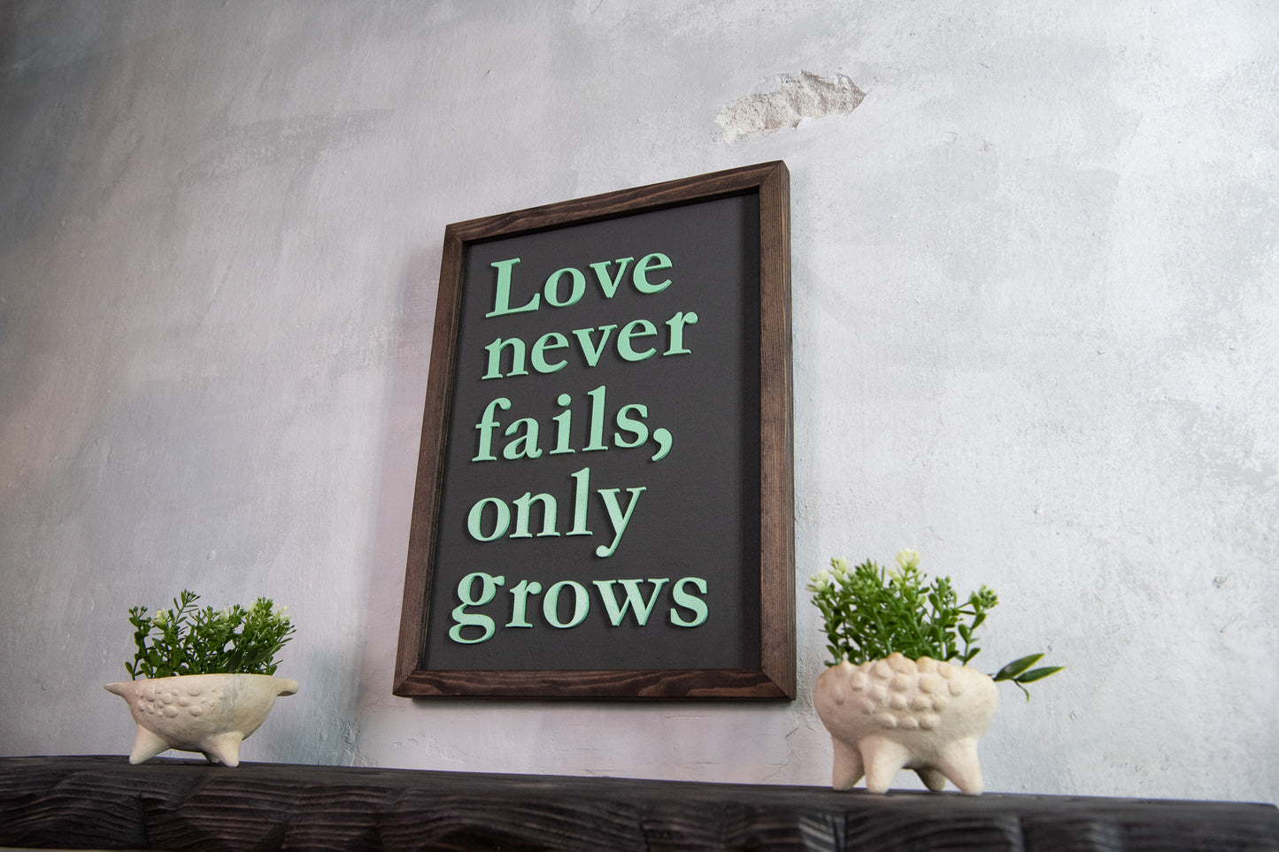 Love Never Fails Wooden Sign – Handmade Wall Art with Cement Texture